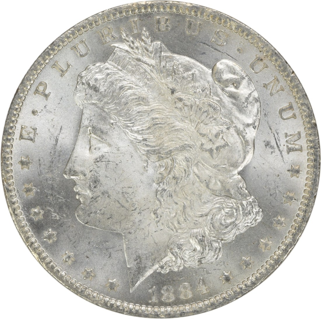 1884-O Silver Morgan Dollar Brilliant Uncirculated Uncertified US Coin: 1884-O Silver Morgan Dollar Brilliant Uncirculated Uncertified US Coin This is an uncirculated 1884-O Morgan Silver Dollar from the New Orleans Mint. The coin is composed of silver, has a denomination