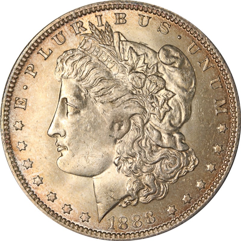 Silver 1888 O Dollar Coin With E Marked Reverse: Silver 1888 O Dollar Coin With E Marked Reverse This is an 1888-O Morgan Silver Dollar featuring an 'E' on the reverse. The coin is composed of silver with a fineness of 0.9 and was minted in New Orle