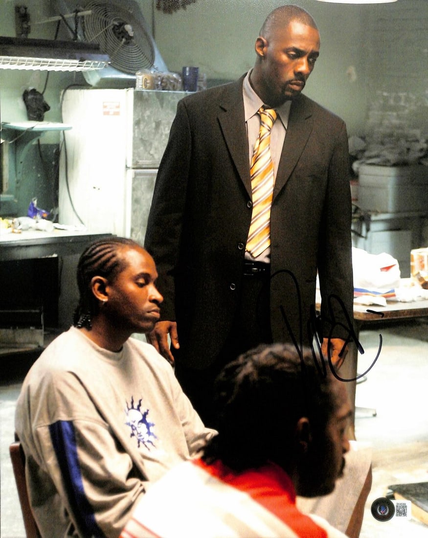 Beckett Authenticated Idris Elba Signed 11x14 Photo from The Wire: Beckett Authenticated Idris Elba Signed 11x14 Photo from The Wire This 11x14 photograph features a hand-signed autograph by Idris Elba, known for his role as Stringer Bell in the acclaimed television 