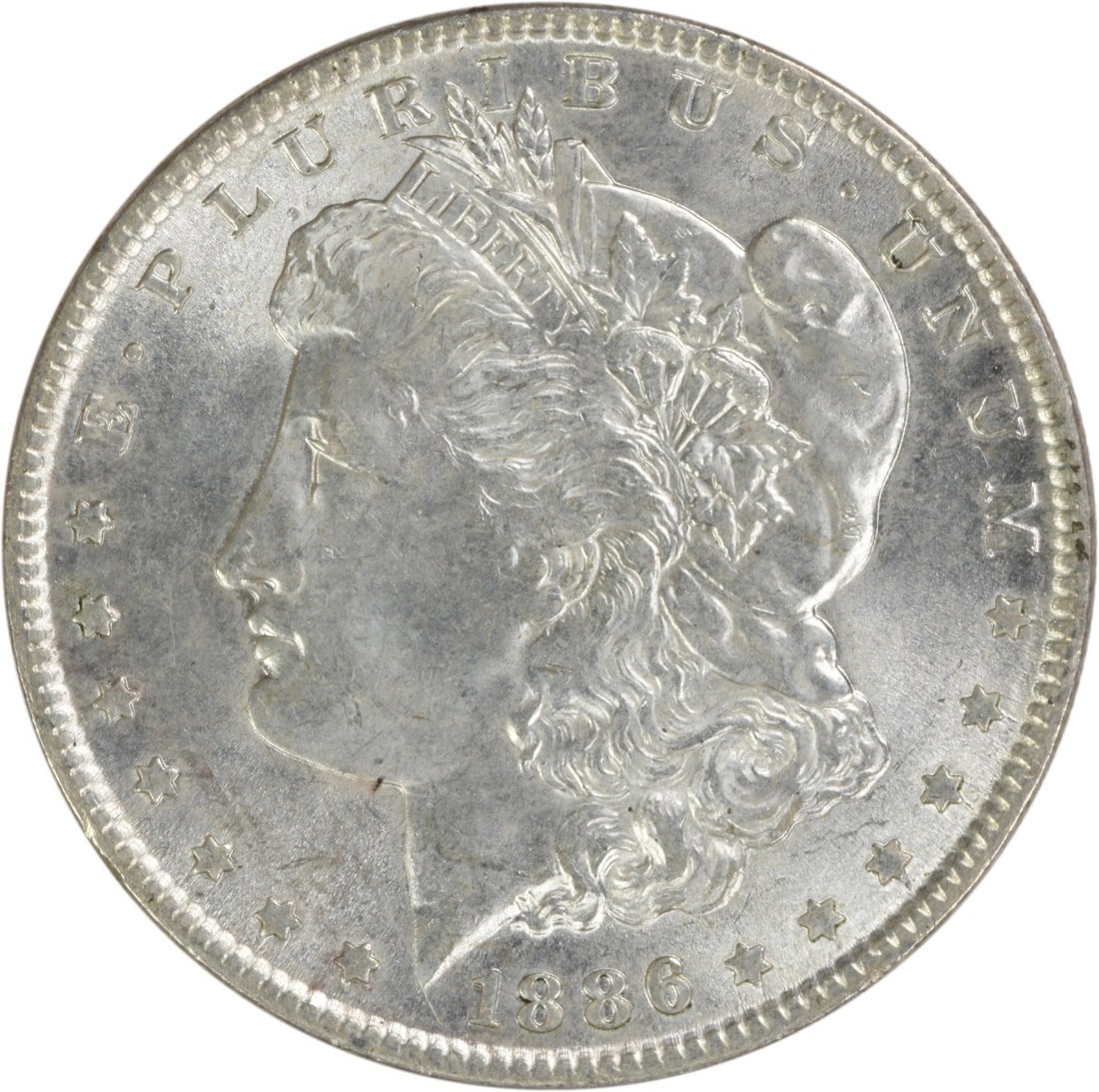 Choice BU 1886 Silver Dollar Morgan Uncirculated Uncertified Coin: Choice BU 1886 Silver Dollar Morgan Uncirculated Uncertified Coin This is an 1886 Morgan Silver Dollar featuring a choice brilliant uncirculated condition. The coin is composed of silver, has no mint 
