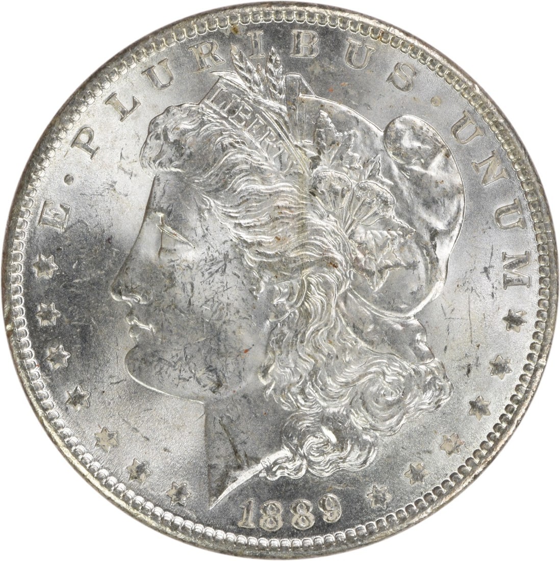 Uncirculated 1889 Silver Morgan Dollar Brilliant BU No Mint Mark: Uncirculated 1889 Silver Morgan Dollar Brilliant BU No Mint Mark This 1889 Morgan Silver Dollar is an uncirculated coin in Brilliant Uncirculated (BU) condition. It is composed of silver and was minte