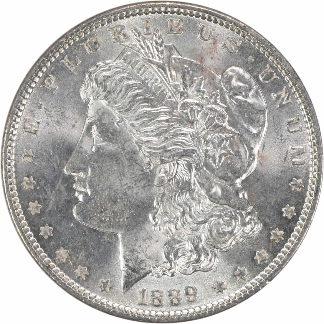 Uncirculated 1889 Silver Morgan Dollar Brilliant BU No Mint Mark: Uncirculated 1889 Silver Morgan Dollar Brilliant BU No Mint Mark This is an 1889 Morgan Silver Dollar from the United States, presented in Brilliant Uncirculated (BU) condition. The coin is composed o
