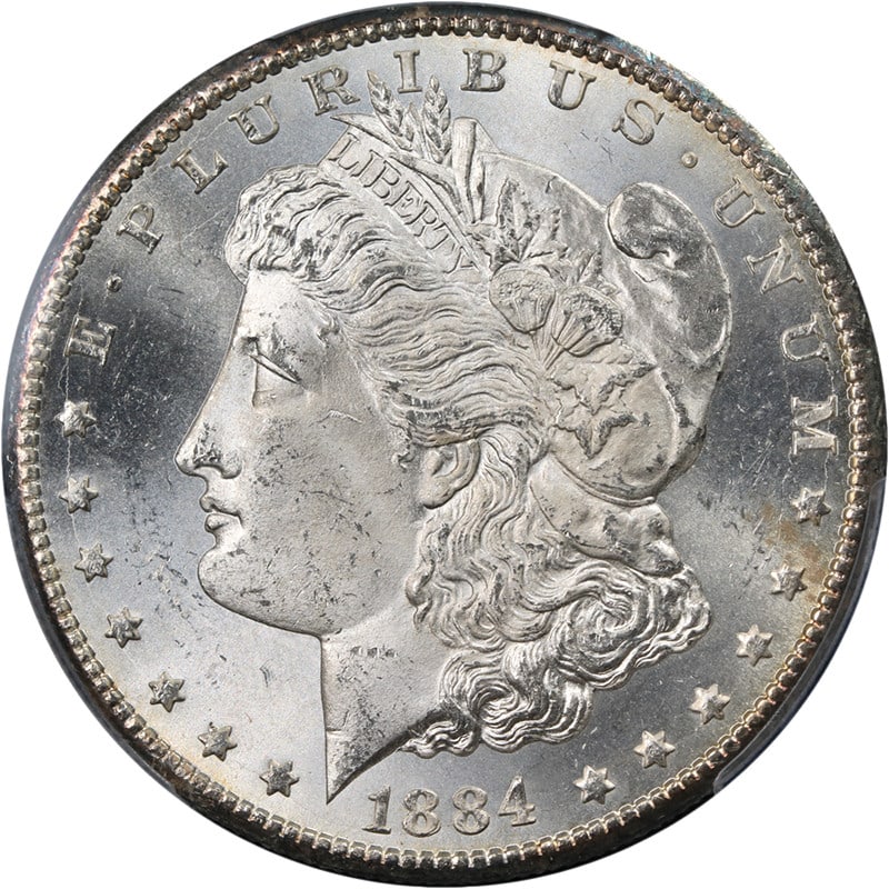 PCGS MS64 1884-CC Morgan Silver Dollar Uncirculated Silver Coin: PCGS MS64 1884-CC Morgan Silver Dollar Uncirculated Silver Coin An original 1884-CC Morgan Silver Dollar certified by PCGS and graded MS64. This uncirculated coin is described as a blazing white gem w
