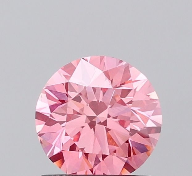 Ideal Loose Diamond - ROUND 1.03ct Fancy Vivid Pink VS1: Ideal Loose Diamond - ROUND 1.03ct Fancy Vivid Pink VS1 Source: This is a real non-mined Diamond that has been grown in a lab Shape: ROUND Carats: 1.03 Color: Fancy Vivid Pink Certification: IGI Video