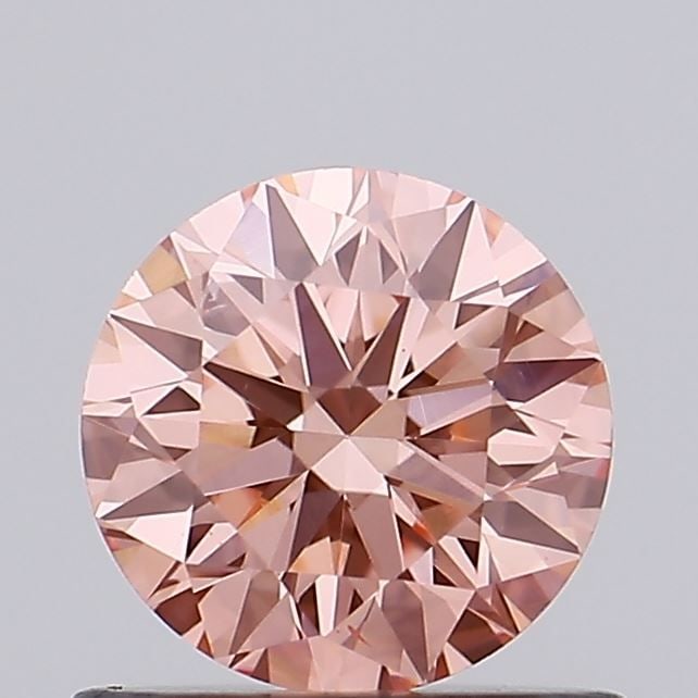 Ideal Loose Diamond - ROUND 0.67ct Fancy Vivid Pink VS2: Ideal Loose Diamond - ROUND 0.67ct Fancy Vivid Pink VS2 Source: This is a real non-mined Diamond that has been grown in a lab Shape: ROUND Carats: 0.67 Color: Fancy Vivid Pink Certification: IGI Video