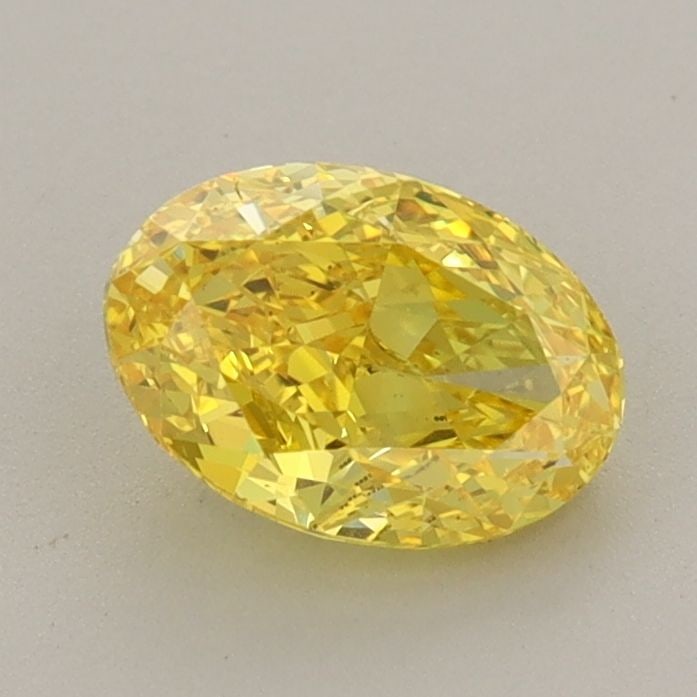 Loose Diamond - OVAL 1.06ct Fancy Vivid Yellow VVS2: Loose Diamond - OVAL 1.06ct Fancy Vivid Yellow VVS2 Source: This is a real non-mined Diamond that has been grown in a lab Shape: OVAL Carats: 1.06 Color: Fancy Vivid Yellow Certification: IGI Addition
