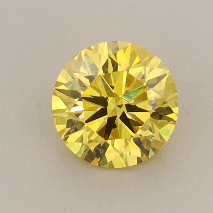 Loose Diamond - ROUND 0.73ct Fancy Vivid Yellow VVS2: Loose Diamond - ROUND 0.73ct Fancy Vivid Yellow VVS2 Source: This is a real non-mined Diamond that has been grown in a lab Shape: ROUND Carats: 0.73 Color: Fancy Vivid Yellow Certification: IGI Video: