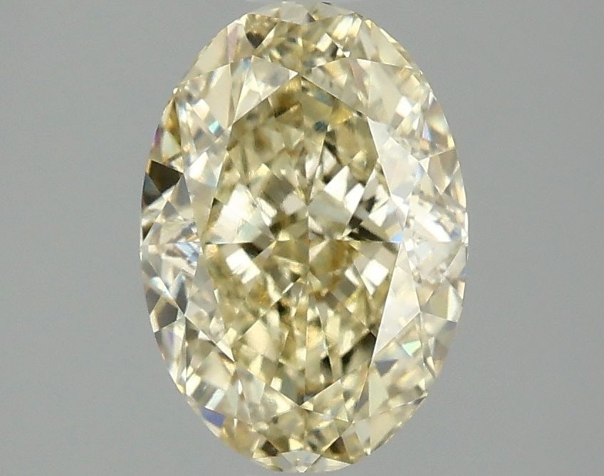 Loose Diamond - OVAL 2.1ct Fancy Yellow VVS2: Loose Diamond - OVAL 2.1ct Fancy Yellow VVS2 Source: This is a real non-mined Diamond that has been grown in a lab Shape: OVAL Carats: 2.1 Color: Fancy Yellow Certification: IGI Video: