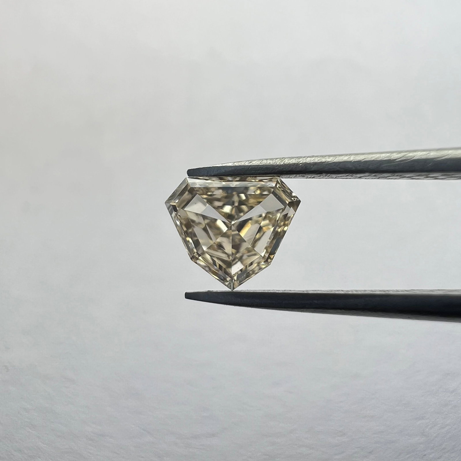 Loose Diamond - SHIELD 0.25ct Brown SI1: Loose Diamond - SHIELD 0.25ct Brown SI1 Source: This is a real non-mined Diamond that has been grown in a lab Shape: SHIELD Carats: 0.25 Color: Brown Certification: NONE Additional images available