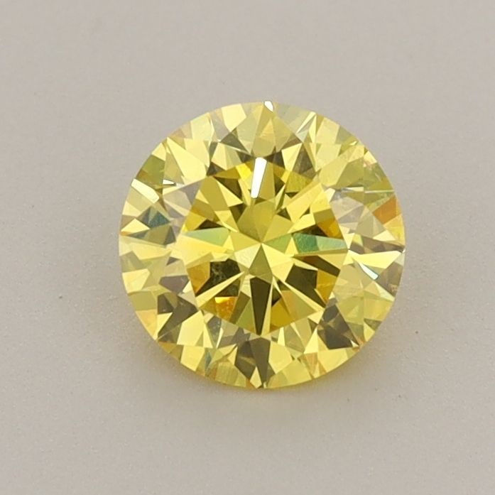 Loose Diamond - ROUND 0.76ct Fancy Vivid Yellow VS2: Loose Diamond - ROUND 0.76ct Fancy Vivid Yellow VS2 Source: This is a real non-mined Diamond that has been grown in a lab Shape: ROUND Carats: 0.76 Color: Fancy Vivid Yellow Certification: IGI Video: