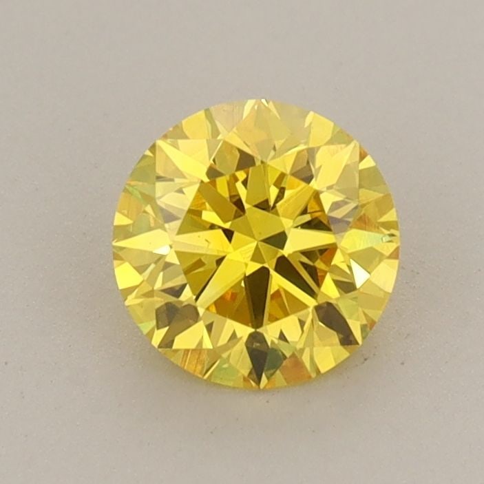Loose Diamond - ROUND 0.71ct Fancy Vivid Yellow VS1: Loose Diamond - ROUND 0.71ct Fancy Vivid Yellow VS1 Source: This is a real non-mined Diamond that has been grown in a lab Shape: ROUND Carats: 0.71 Color: Fancy Vivid Yellow Certification: IGI Video: