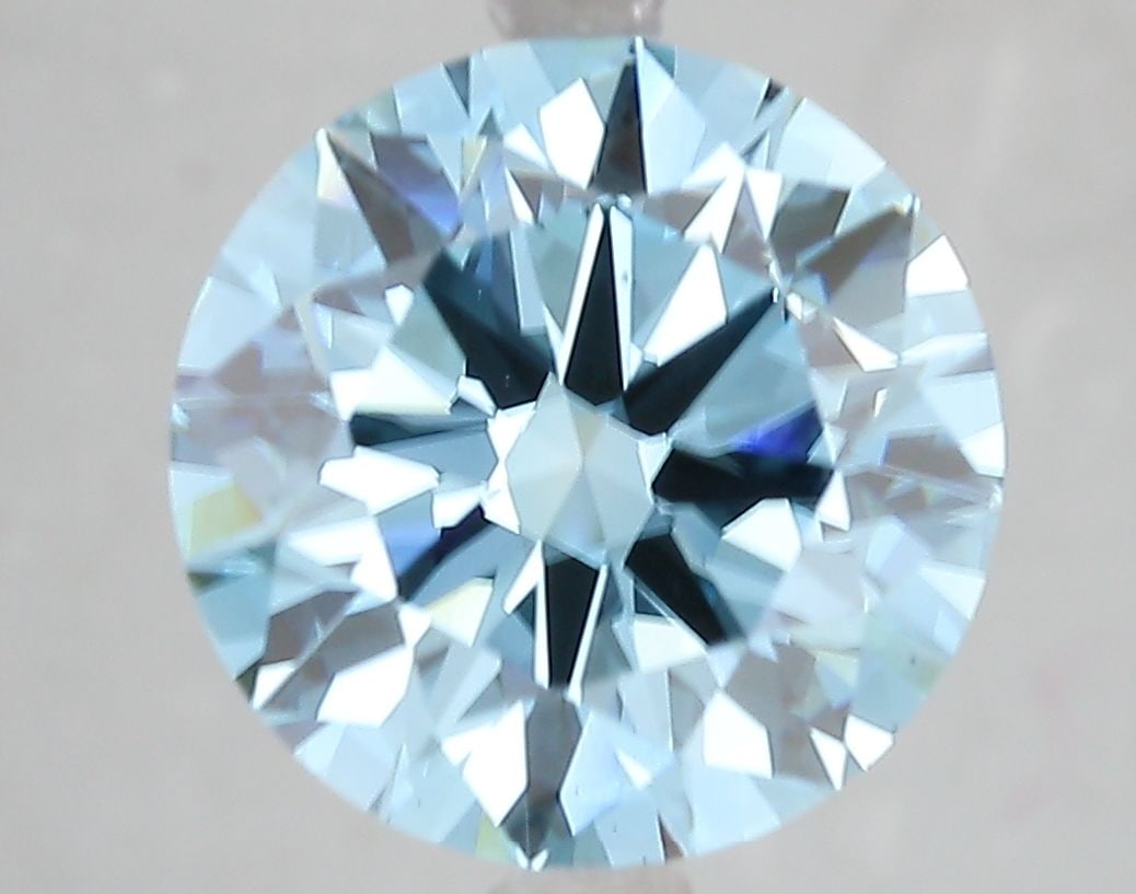 Ideal Loose Diamond - ROUND 5.11ct Fancy Vivid Blue VS1: Ideal Loose Diamond - ROUND 5.11ct Fancy Vivid Blue VS1 Source: This is a real non-mined Diamond that has been grown in a lab Shape: ROUND Carats: 5.11 Color: Fancy Vivid Blue Certification: IGI Video