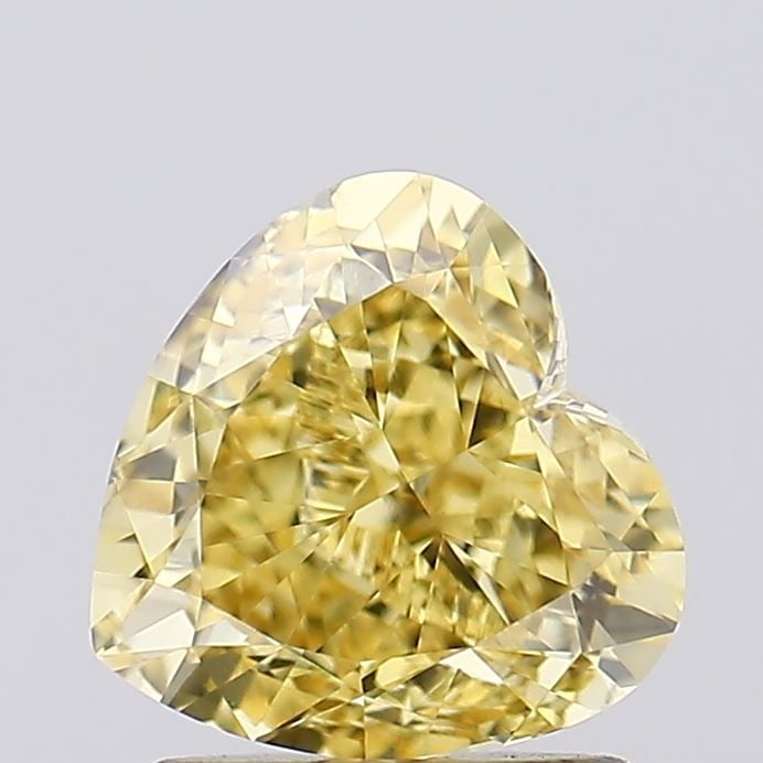 Loose Diamond - HEART 1.52ct Fancy Vivid Yellow VVS2: Loose Diamond - HEART 1.52ct Fancy Vivid Yellow VVS2 Source: This is a real non-mined Diamond that has been grown in a lab Shape: HEART Carats: 1.52 Color: Fancy Vivid Yellow Certification: IGI Video:
