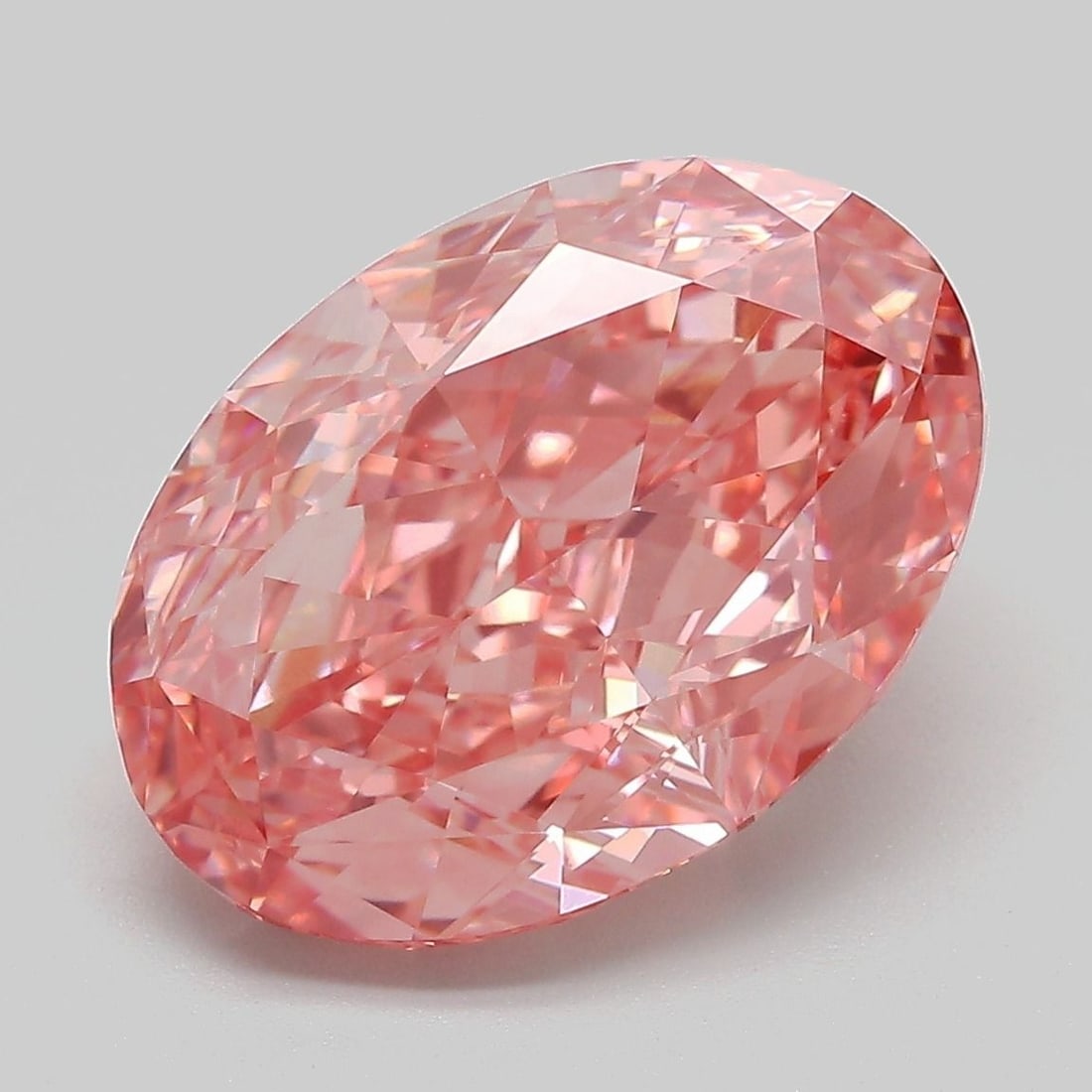 Loose Diamond - OVAL 7.04ct Fancy Vivid Pink VVS2: Loose Diamond - OVAL 7.04ct Fancy Vivid Pink VVS2 Source: This is a real non-mined Diamond that has been grown in a lab Shape: OVAL Carats: 7.04 Color: Fancy Vivid Pink Certification: IGI Video: