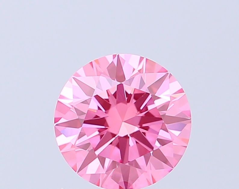 Ideal Loose Diamond - ROUND 0.93ct Fancy Vivid Pink VS1: Ideal Loose Diamond - ROUND 0.93ct Fancy Vivid Pink VS1 Source: This is a real non-mined Diamond that has been grown in a lab Shape: ROUND Carats: 0.93 Color: Fancy Vivid Pink Certification: IGI Addit