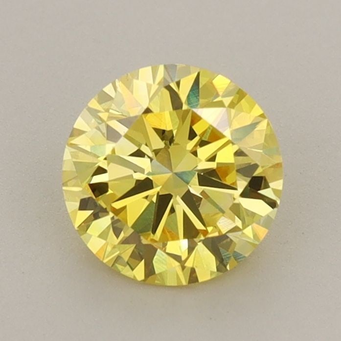 Loose Diamond - ROUND 1.04ct Fancy Vivid Yellow VS1: Loose Diamond - ROUND 1.04ct Fancy Vivid Yellow VS1 Source: This is a real non-mined Diamond that has been grown in a lab Shape: ROUND Carats: 1.04 Color: Fancy Vivid Yellow Certification: IGI Video: