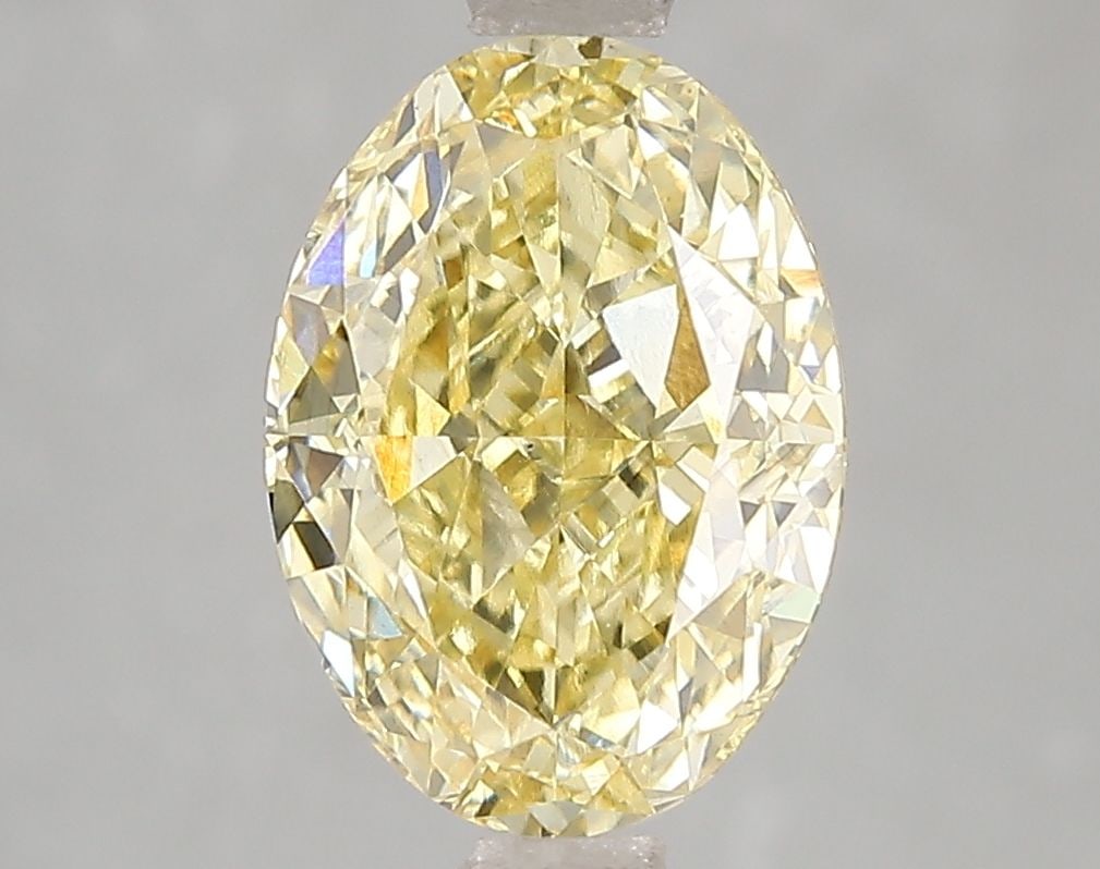 Loose Diamond - OVAL 3.04ct Fancy Vivid Yellow VS2: Loose Diamond - OVAL 3.04ct Fancy Vivid Yellow VS2 Source: This is a real non-mined Diamond that has been grown in a lab Shape: OVAL Carats: 3.04 Color: Fancy Vivid Yellow Certification: IGI Video:
