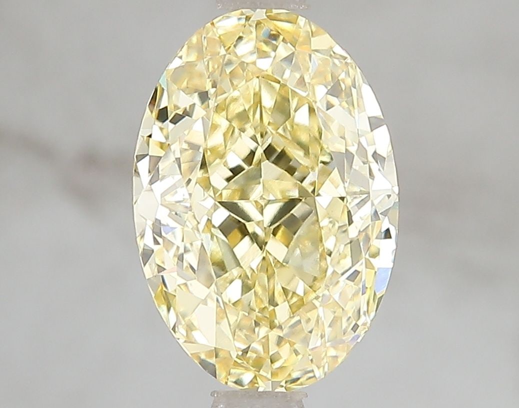 Loose Diamond - OVAL 3.1ct Fancy Vivid Yellow VS1: Loose Diamond - OVAL 3.1ct Fancy Vivid Yellow VS1 Source: This is a real non-mined Diamond that has been grown in a lab Shape: OVAL Carats: 3.1 Color: Fancy Vivid Yellow Certification: IGI Video:
