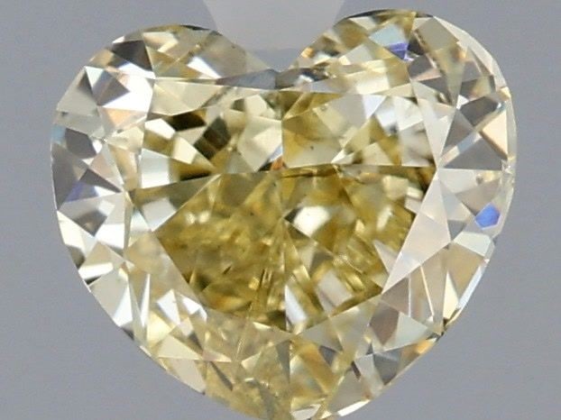 Loose Diamond - HEART 1.01ct Fancy Yellow VS2: Loose Diamond - HEART 1.01ct Fancy Yellow VS2 Source: This is a real non-mined Diamond that has been grown in a lab Shape: HEART Carats: 1.01 Color: Fancy Yellow Certification: IGI Video:
