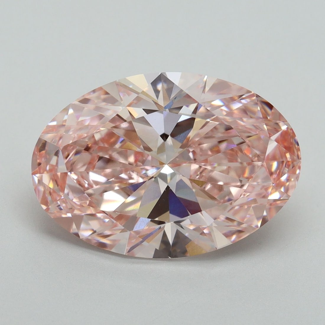 Loose Diamond - OVAL 7.38ct Fancy Vivid Pink VVS2: Loose Diamond - OVAL 7.38ct Fancy Vivid Pink VVS2 Source: This is a real non-mined Diamond that has been grown in a lab Shape: OVAL Carats: 7.38 Color: Fancy Vivid Pink Certification: IGI Video: