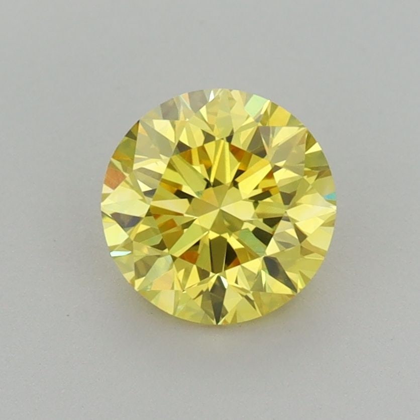 Loose Diamond - ROUND 1.01ct Fancy Vivid Yellow VVS2: Loose Diamond - ROUND 1.01ct Fancy Vivid Yellow VVS2 Source: This is a real non-mined Diamond that has been grown in a lab Shape: ROUND Carats: 1.01 Color: Fancy Vivid Yellow Certification: IGI Additi