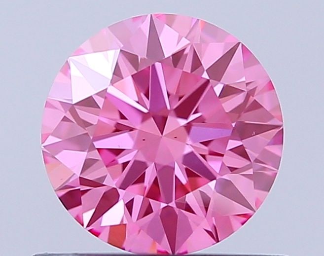 Ideal Loose Diamond - ROUND 0.73ct Fancy Vivid Pink VS2: Ideal Loose Diamond - ROUND 0.73ct Fancy Vivid Pink VS2 Source: This is a real non-mined Diamond that has been grown in a lab Shape: ROUND Carats: 0.73 Color: Fancy Vivid Pink Certification: IGI Video