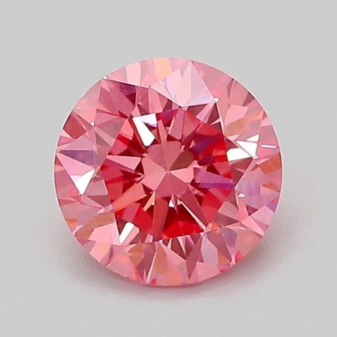 Loose Diamond - ROUND 1.1ct Fancy Vivid Pink VS2: Loose Diamond - ROUND 1.1ct Fancy Vivid Pink VS2 Source: This is a real non-mined Diamond that has been grown in a lab Shape: ROUND Carats: 1.1 Color: Fancy Vivid Pink Certification: IGI Additional im