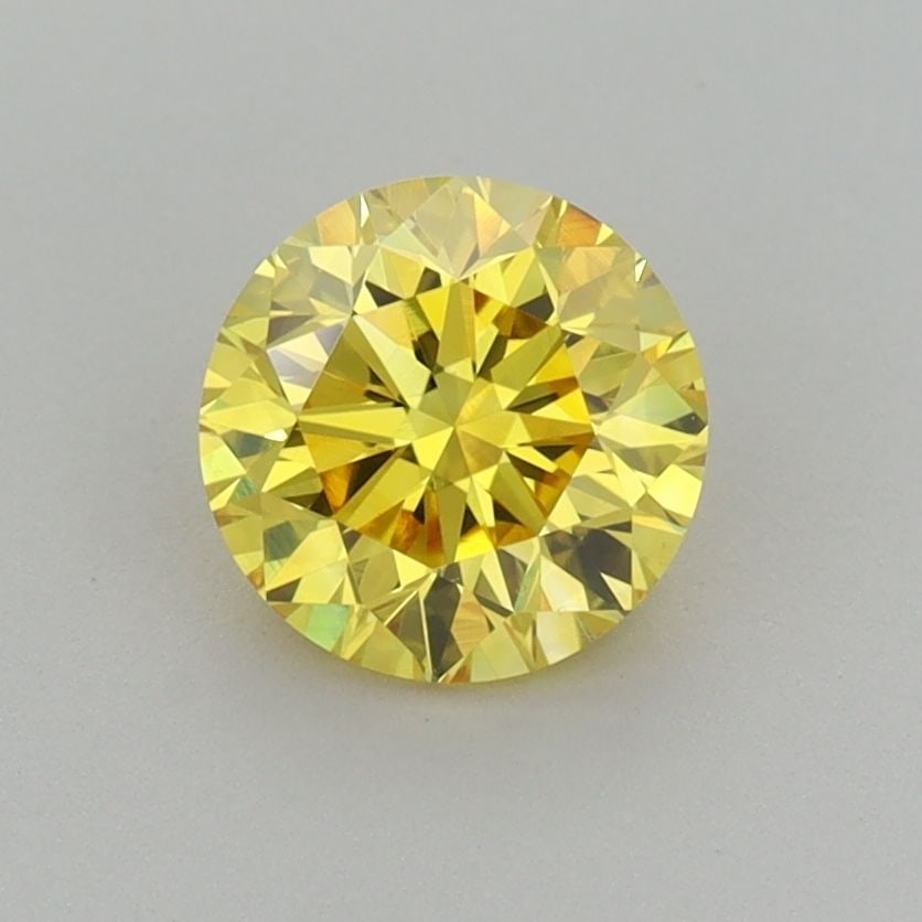 Loose Diamond - ROUND 1.0ct Fancy Vivid Yellow VS1: Loose Diamond - ROUND 1.0ct Fancy Vivid Yellow VS1 Source: This is a real non-mined Diamond that has been grown in a lab Shape: ROUND Carats: 1.0 Color: Fancy Vivid Yellow Certification: IGI Additiona