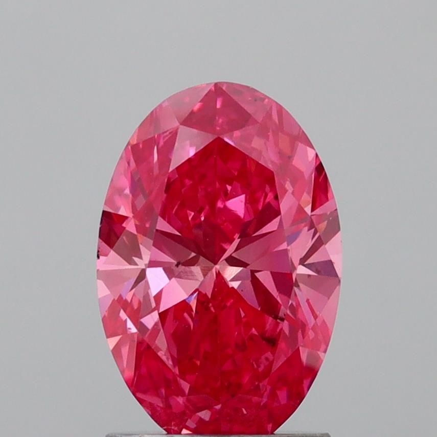 Loose Diamond - OVAL 1.55ct Fancy Vivid Pink SI1: Loose Diamond - OVAL 1.55ct Fancy Vivid Pink SI1 Source: This is a real non-mined Diamond that has been grown in a lab Shape: OVAL Carats: 1.55 Color: Fancy Vivid Pink Certification: IGI Video: