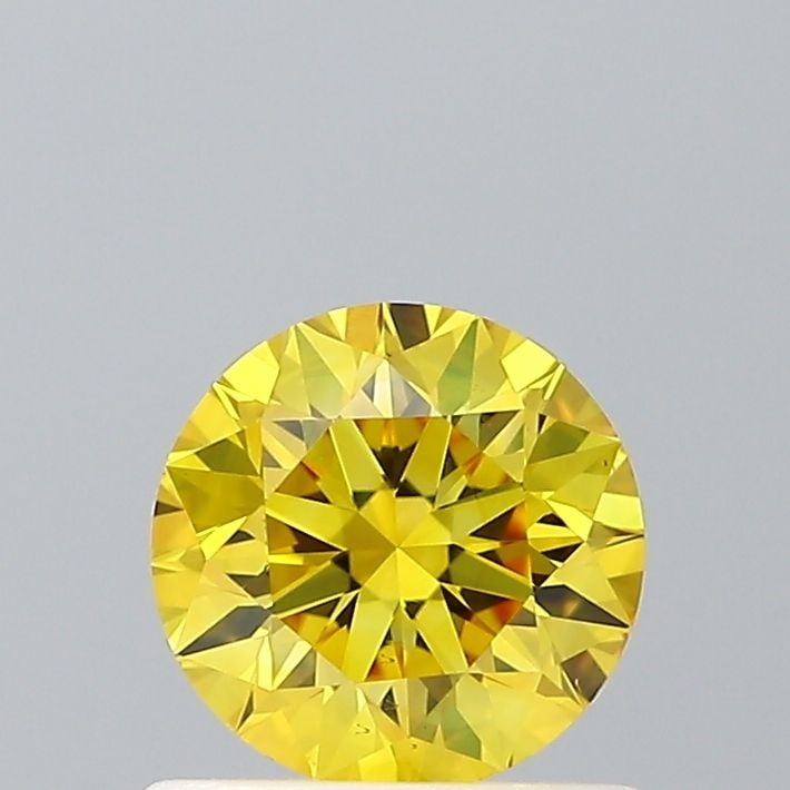 Loose Diamond - ROUND 0.65ct Fancy Vivid Yellow VS2: Loose Diamond - ROUND 0.65ct Fancy Vivid Yellow VS2 Source: This is a real non-mined Diamond that has been grown in a lab Shape: ROUND Carats: 0.65 Color: Fancy Vivid Yellow Certification: IGI Video: