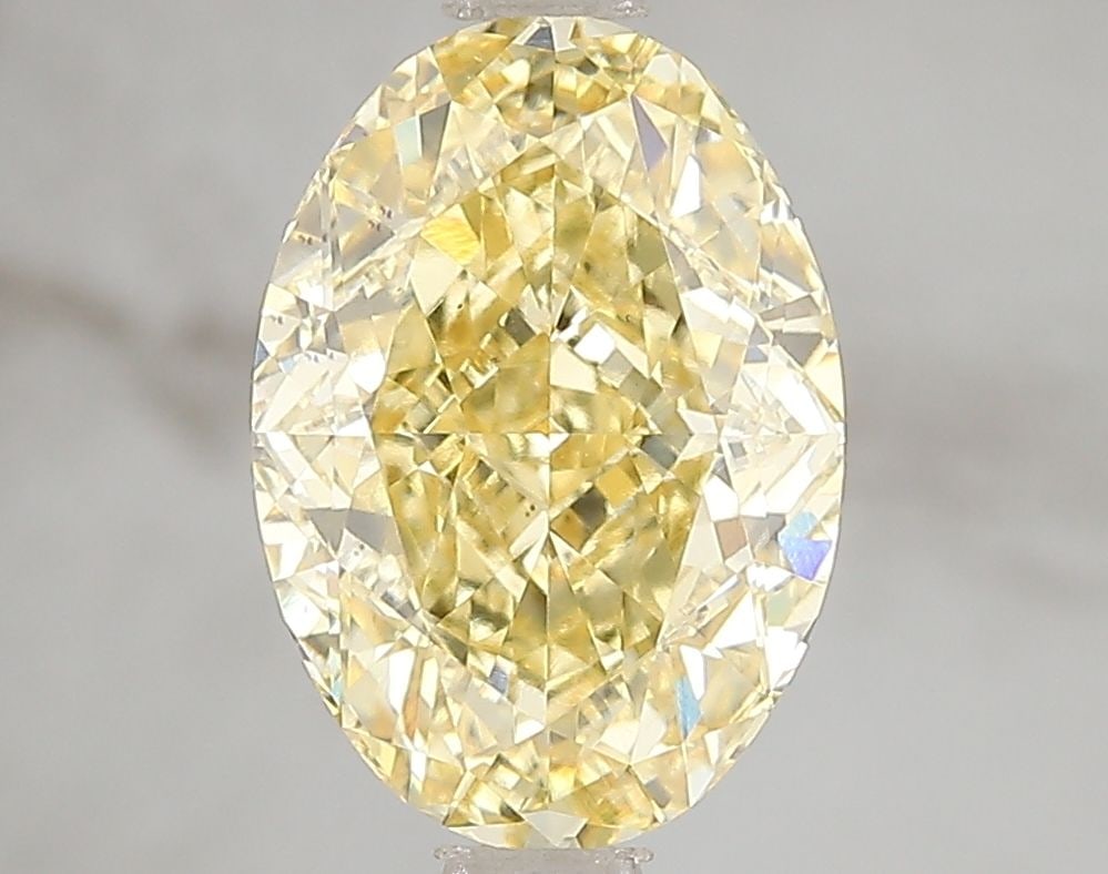 Loose Diamond - OVAL 3.07ct Fancy Vivid Yellow VS1: Loose Diamond - OVAL 3.07ct Fancy Vivid Yellow VS1 Source: This is a real non-mined Diamond that has been grown in a lab Shape: OVAL Carats: 3.07 Color: Fancy Vivid Yellow Certification: IGI Video: