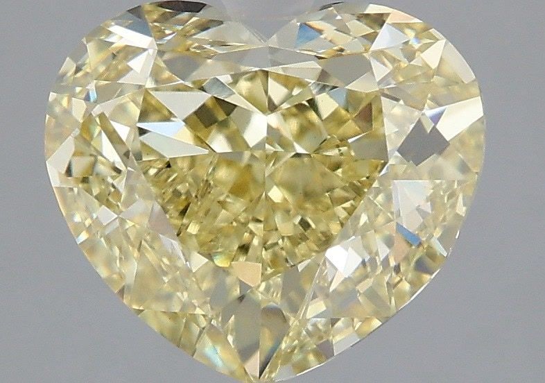 Loose Diamond - HEART 3.06ct Fancy Yellow VVS2: Loose Diamond - HEART 3.06ct Fancy Yellow VVS2 Source: This is a real non-mined Diamond that has been grown in a lab Shape: HEART Carats: 3.06 Color: Fancy Yellow Certification: IGI Video: