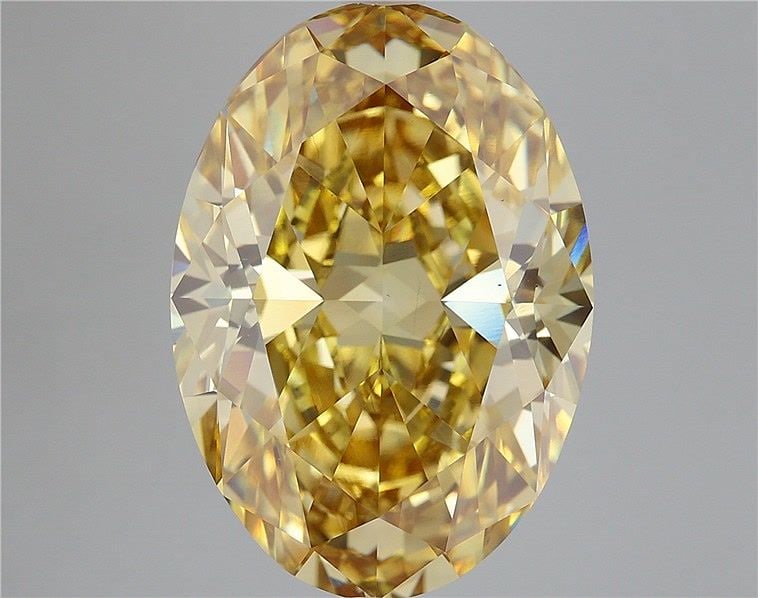 Loose Diamond - OVAL 13.4ct Fancy Vivid Yellow VS1: Loose Diamond - OVAL 13.4ct Fancy Vivid Yellow VS1 Source: This is a real non-mined Diamond that has been grown in a lab Shape: OVAL Carats: 13.4 Color: Fancy Vivid Yellow Certification: IGI Video: