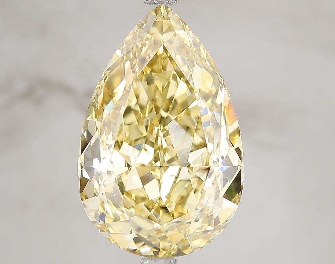 Loose Diamond - PEAR 7.05ct Fancy Vivid Yellow SI1: Loose Diamond - PEAR 7.05ct Fancy Vivid Yellow SI1 Source: This is a real non-mined Diamond that has been grown in a lab Shape: PEAR Carats: 7.05 Color: Fancy Vivid Yellow Certification: IGI Video: