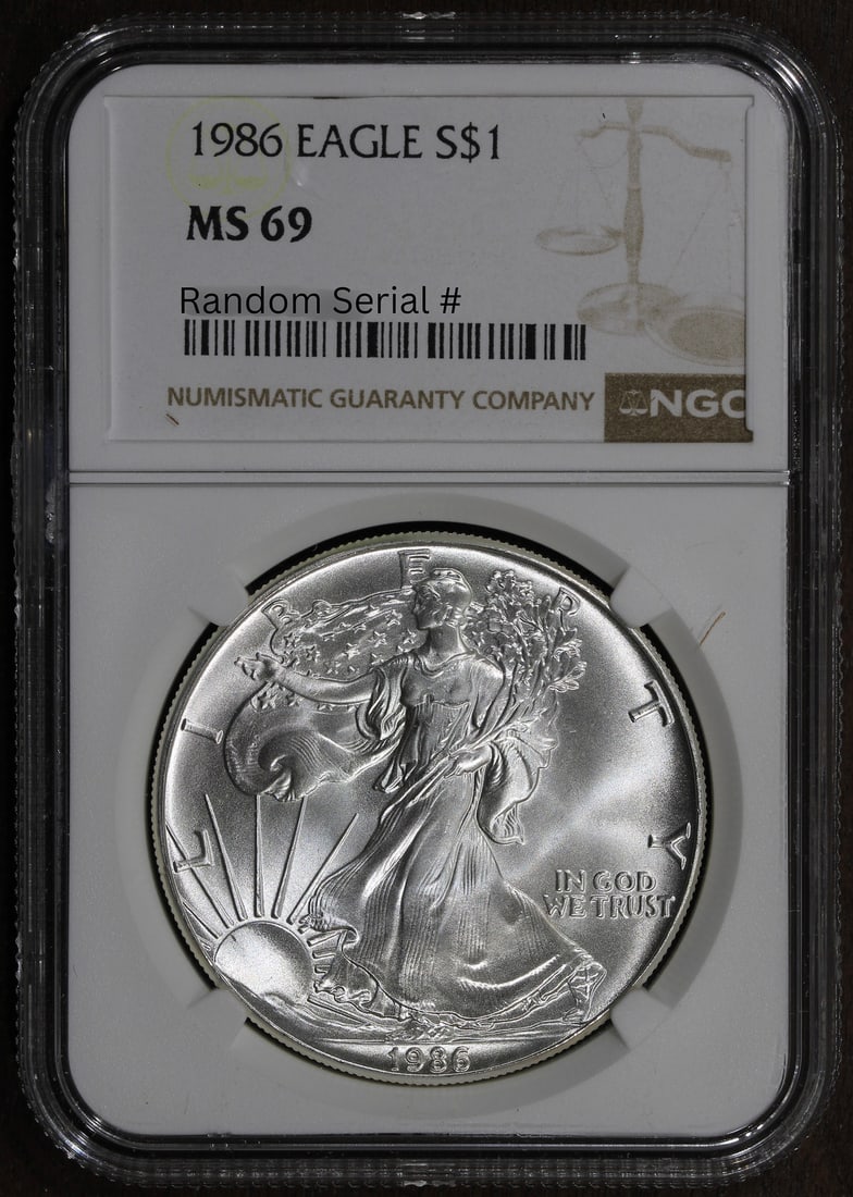 1986 Silver American Eagle Dollar NGC MS69 Certified 1 oz Coin: 1986 Silver American Eagle Dollar NGC MS69 Certified 1 oz Coin This 1986 American Silver Eagle $1 coin features a fineness of 0.999 silver and contains 1 oz of precious metal. Graded MS 69 by NGC, it 