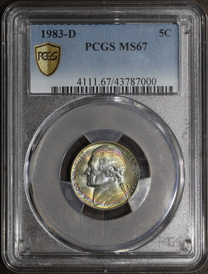 PCGS MS67 1983-D Jefferson Nickel Rainbow Toned 5C: PCGS MS67 1983-D Jefferson Nickel Rainbow Toned 5C This 1983-D Jefferson Nickel features a rainbow-toned finish and has been graded MS67 by the Professional Coin Grading Service (PCGS). Struck in Denv