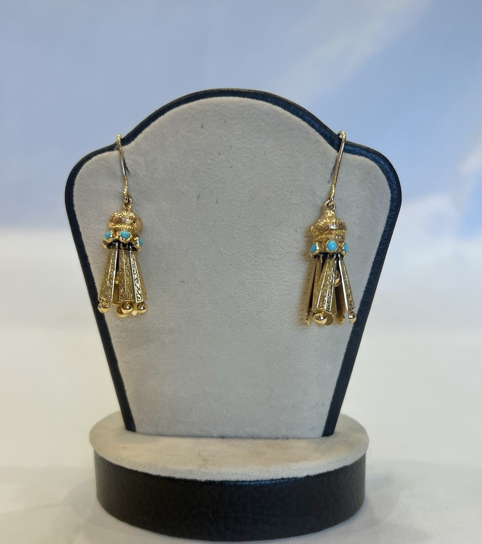 18k Yellow Gold Turquoise Dangle Earrings Pair: 18k Yellow Gold Turquoise Dangle Earrings Pair This is a stunning pair of early 1900s dangle/drop earrings crafted from 18k yellow gold and set with turquoise stones. Featuring intricate detailing and