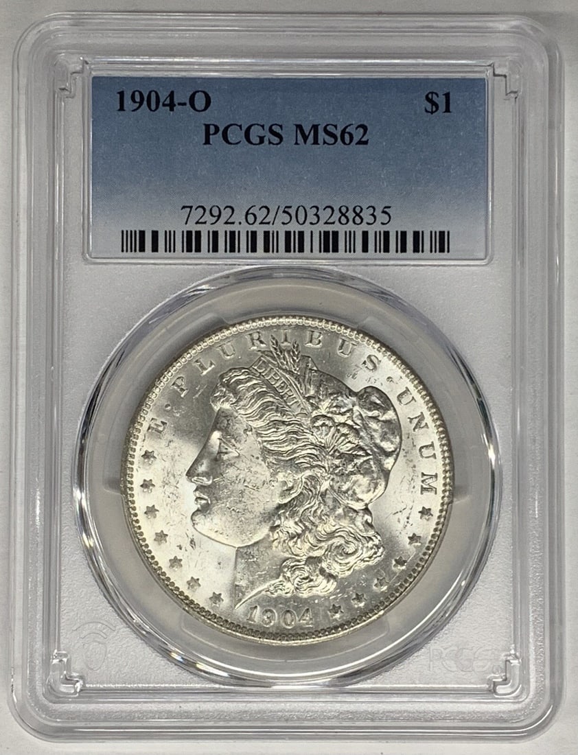 1904-O Morgan Silver Dollar PCGS MS 62 Uncirculated US Coin: 1904-O Morgan Silver Dollar PCGS MS 62 Uncirculated US Coin This is a 1904-O Morgan Silver Dollar coin from the United States, featuring a $1 denomination. The coin is composed of silver and has been 