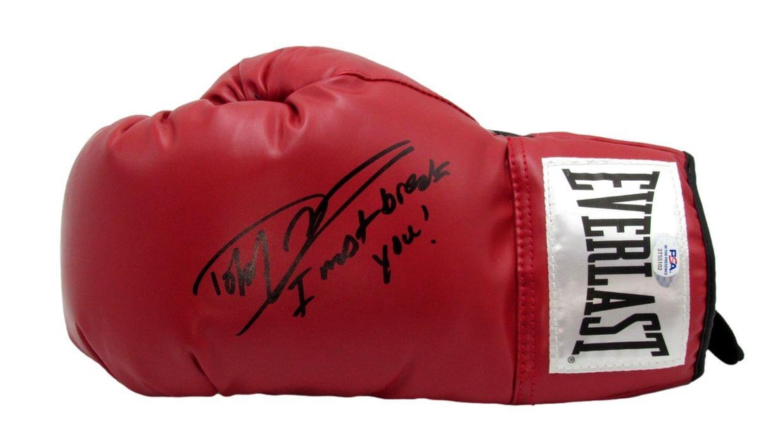 Boxing Glove Autographed by Dolph Lundgren With PSA DNA Authentication: Boxing Glove Autographed by Dolph Lundgren With PSA DNA Authentication This pre-owned boxing glove features the autograph of Dolph Lundgren, known for his iconic role as Drago. The glove includes the 