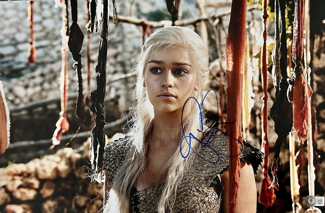 Emilia Clarke Autographed 12x18 Daenerys Photo Beckett Authenticated: Emilia Clarke Autographed 12x18 Daenerys Photo Beckett Authenticated This 12x18 color photograph features Emilia Clarke as Daenerys Targaryen from the TV series Game of Thrones. The photo has been han