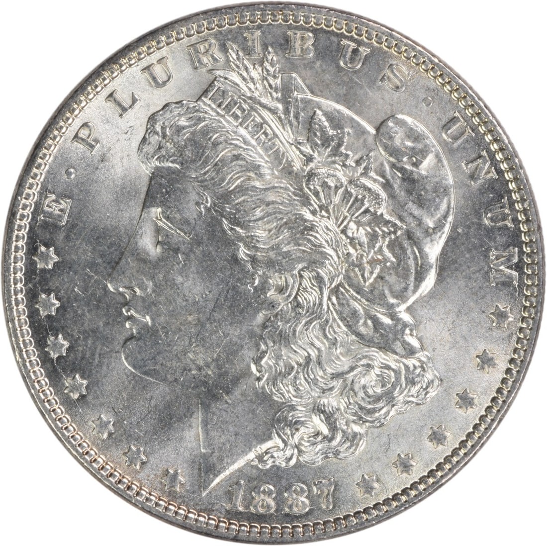 Uncirculated 1887 Silver Morgan Dollar Brilliant Uncirculated Uncertified Coin: Uncirculated 1887 Silver Morgan Dollar Brilliant Uncirculated Uncertified Coin This 1887 Morgan Silver Dollar is a Brilliant Uncirculated (BU) coin from the United States. Composed of silver, it featu