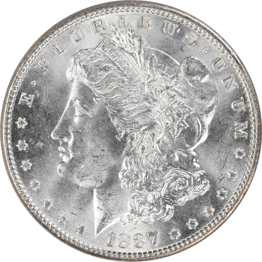 1887 Uncirculated Morgan $1 Silver Coin Uncertified: 1887 Uncirculated Morgan $1 Silver Coin Uncertified 1887 Morgan Silver Dollar in uncirculated, pre-owned condition. This uncertified silver $1 coin is identified as KM Number 110 and listed with a gra