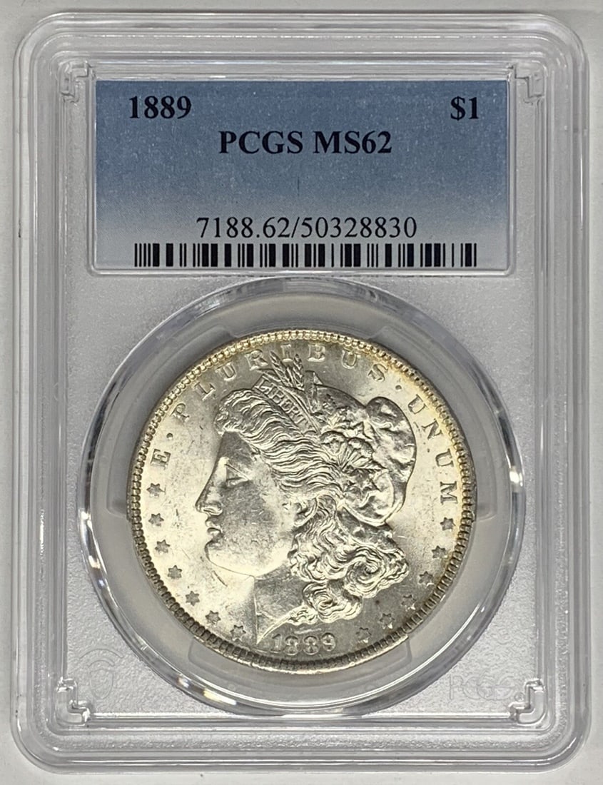 PCGS MS 62 Graded 1889 Morgan Silver Dollar Coin: PCGS MS 62 Graded 1889 Morgan Silver Dollar Coin This 1889 Morgan Silver Dollar is an uncirculated coin graded MS 62 by PCGS. It features the classic Morgan design and is composed of silver. This coll