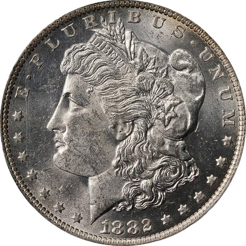 PCGS MS63 1882 O Morgan Silver Dollar Blast White: PCGS MS63 1882 O Morgan Silver Dollar Blast White Original 1882-O Morgan Silver Dollar graded PCGS MS63. This uncirculated coin is described as blast white with strong strike, fantastic luster, great 
