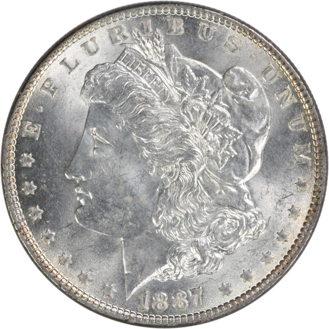 Choice BU 1887 Silver Morgan Dollar Uncirculated Uncertified Coin: Choice BU 1887 Silver Morgan Dollar Uncirculated Uncertified Coin This 1887 Morgan Silver Dollar is a choice brilliant uncirculated example, featuring no mint mark. The coin is composed of silver and 