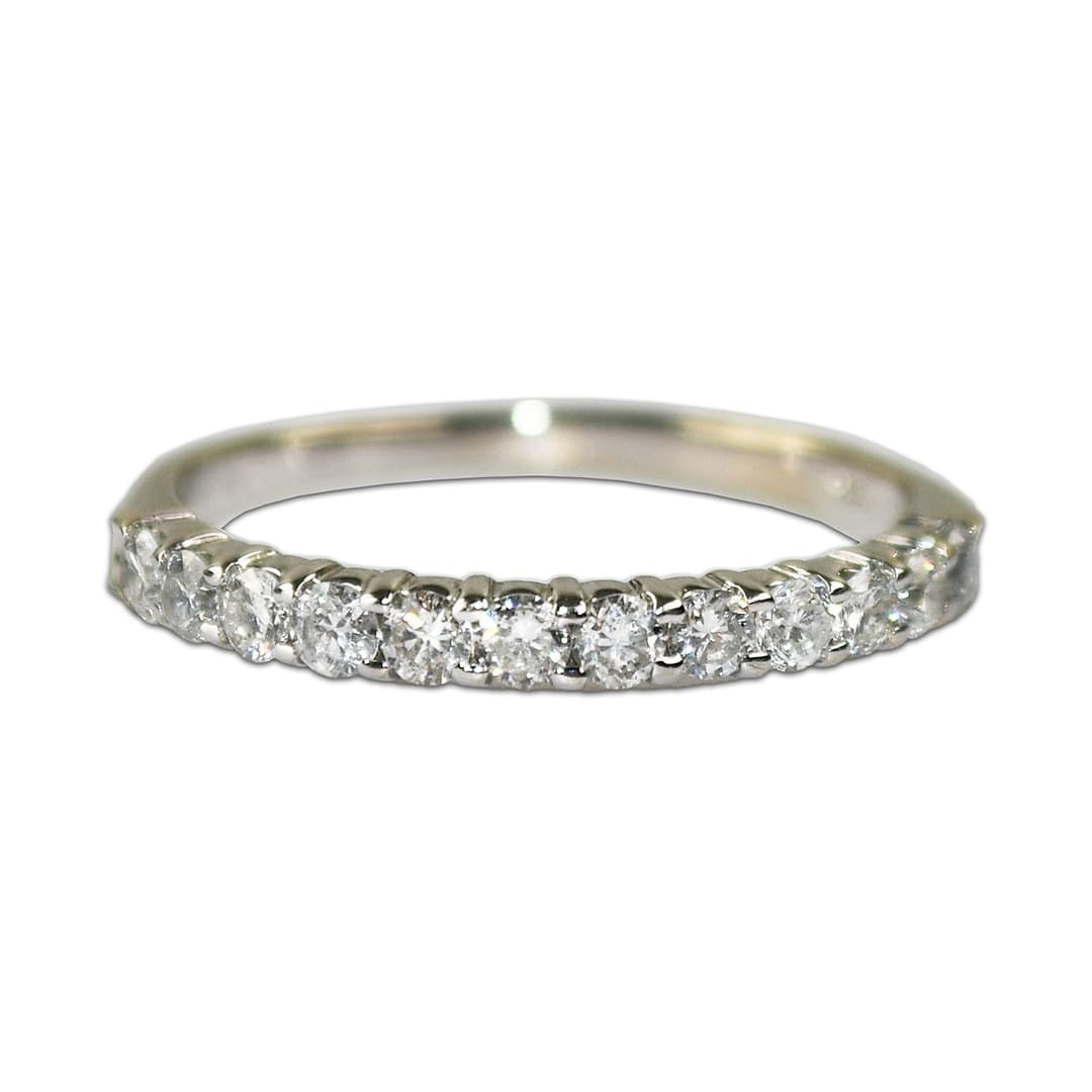14K White Gold Channel Set Diamond Band Ring Size 6.25: 14K White Gold Channel Set Diamond Band Ring Size 6.25 This elegant band ring is crafted from 14K white gold and features round brilliant cut natural diamonds with a total weight of 0.35 carats. The d