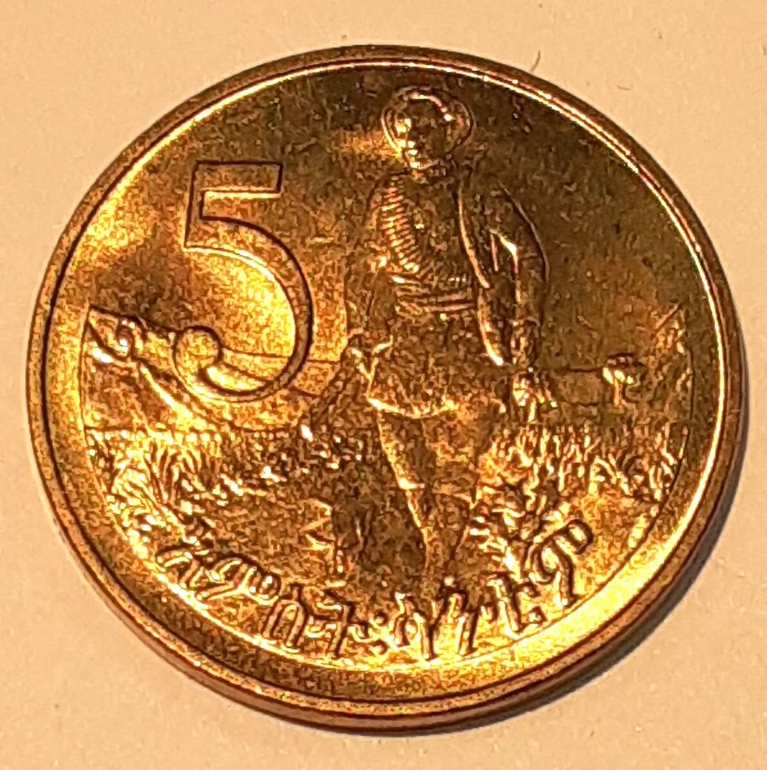 Roll of 20 Uncirculated 1977 Ethiopia 5 Santim Nickel-Brass Lion Coins: Roll of 20 Uncirculated 1977 Ethiopia 5 Santim Nickel-Brass Lion Coins This roll contains 20 uncirculated 5 Santim coins from Ethiopia, dated 1977. Each coin is composed of nickel-brass and features a