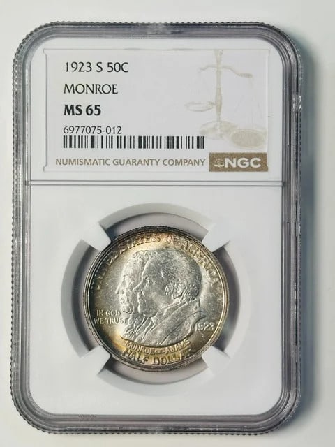 1923 S Monroe Silver Commemorative Dollar NGC MS65 Rainbow Toned: 1923 S Monroe Silver Commemorative Dollar NGC MS65 Rainbow Toned 1923 Monroe commemorative silver dollar graded MS 65 by NGC. This pre-owned coin is identified as a 1923 MONROE issue and features rain
