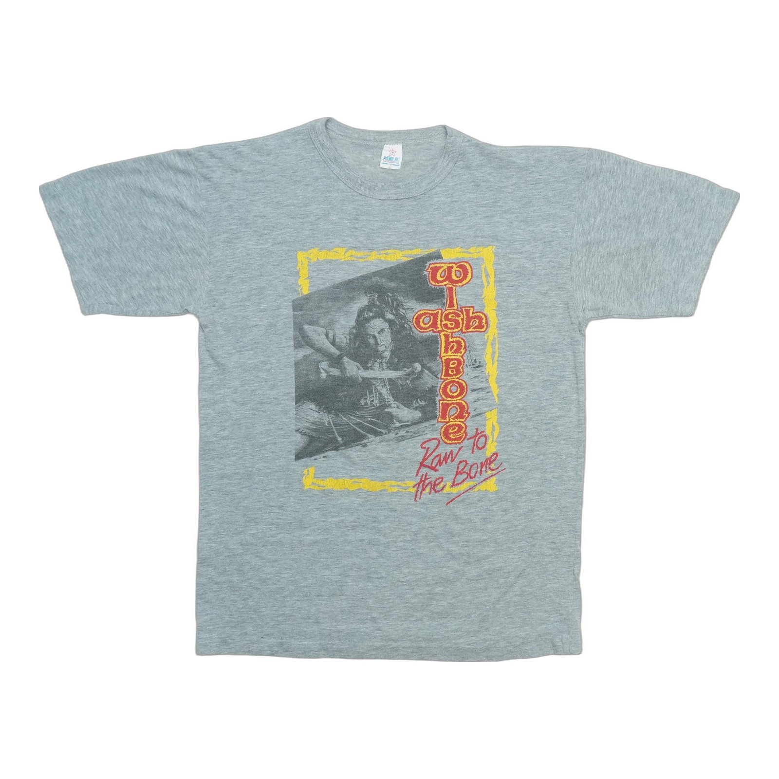 Vintage Wishbone Ash 1985 Tour Tee Raw To The Bone Grey Medium: Vintage Wishbone Ash 1985 Tour Tee Raw To The Bone Grey Medium This is an original vintage 1985 Wishbone Ash Raw To The Bone Tour shirt. The shirt is not a modern reproduction and is made from a cotto