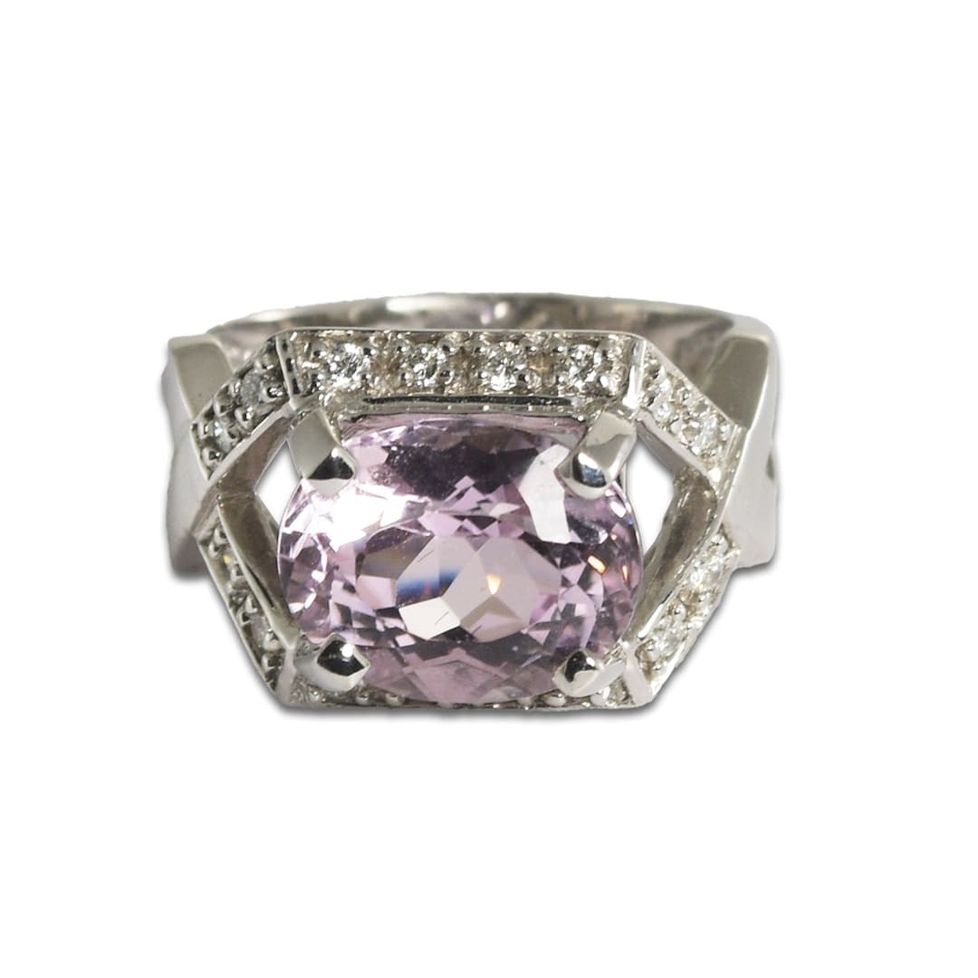 Size 8 18k White Gold Ring with Oval Kunzite and Diamond Accents: Size 8 18k White Gold Ring with Oval Kunzite and Diamond Accents Designer style ring featuring a natural oval pink kunzite accented by round brilliant cut diamonds. Crafted in 18k white gold, this pre